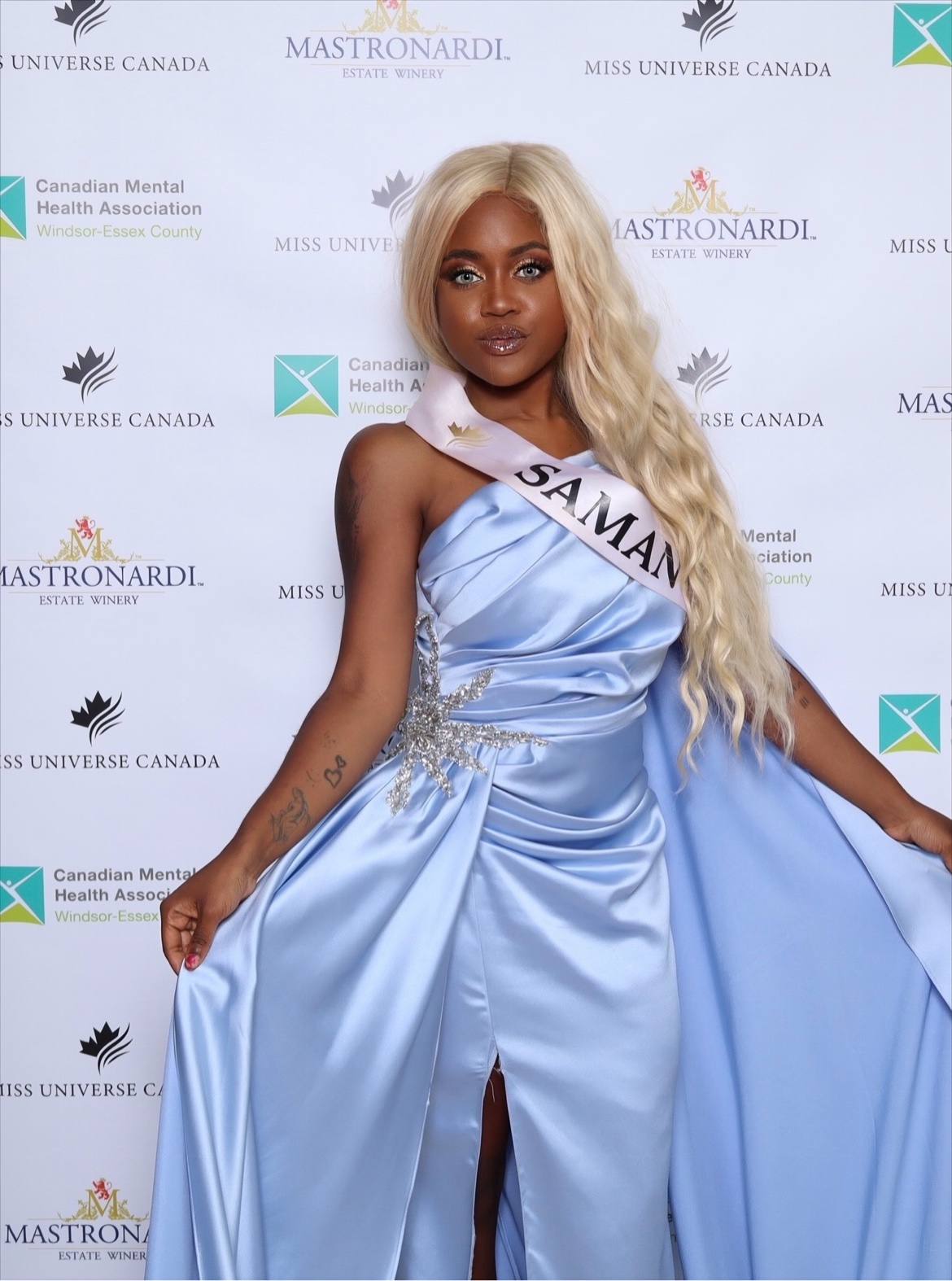 Samantha Samaka in a blue pageant gown with sash, Miss Universe Canada